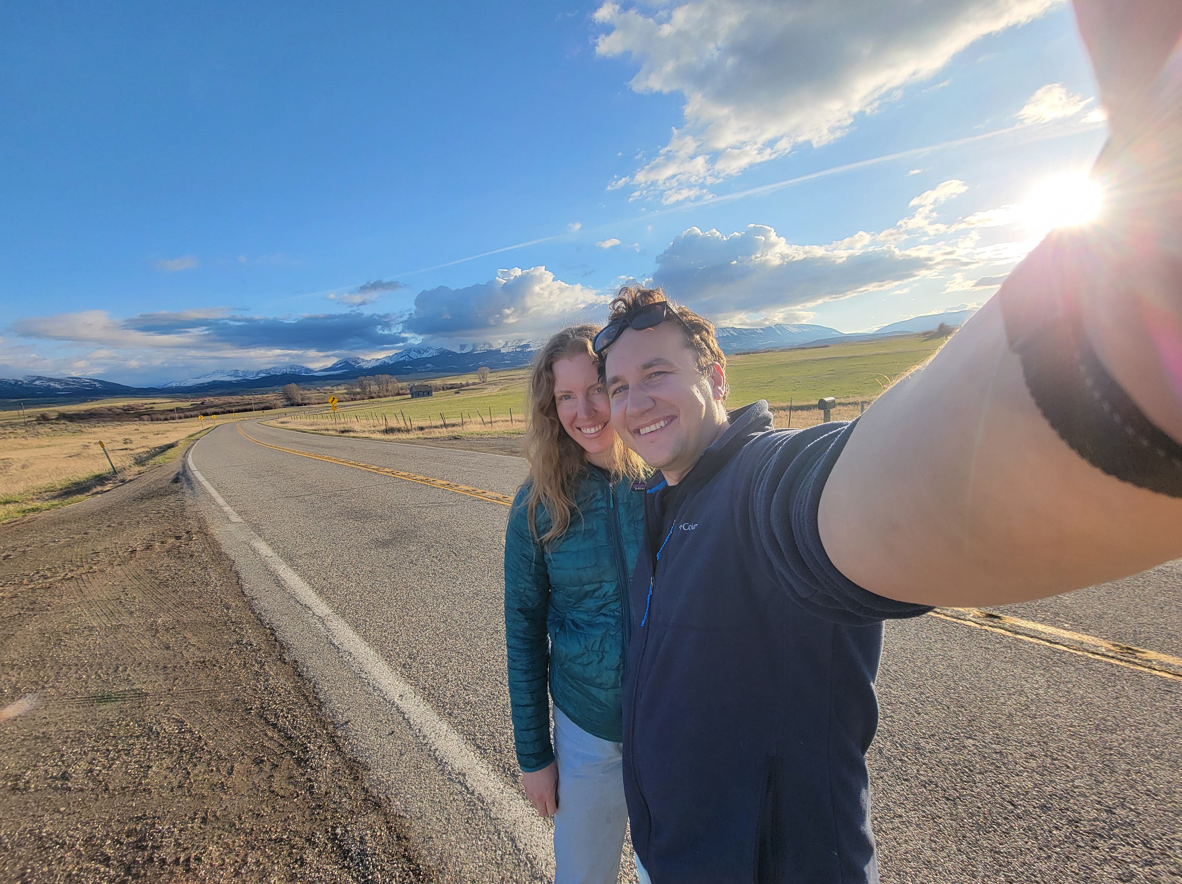 Road trip selfie with mountains in background