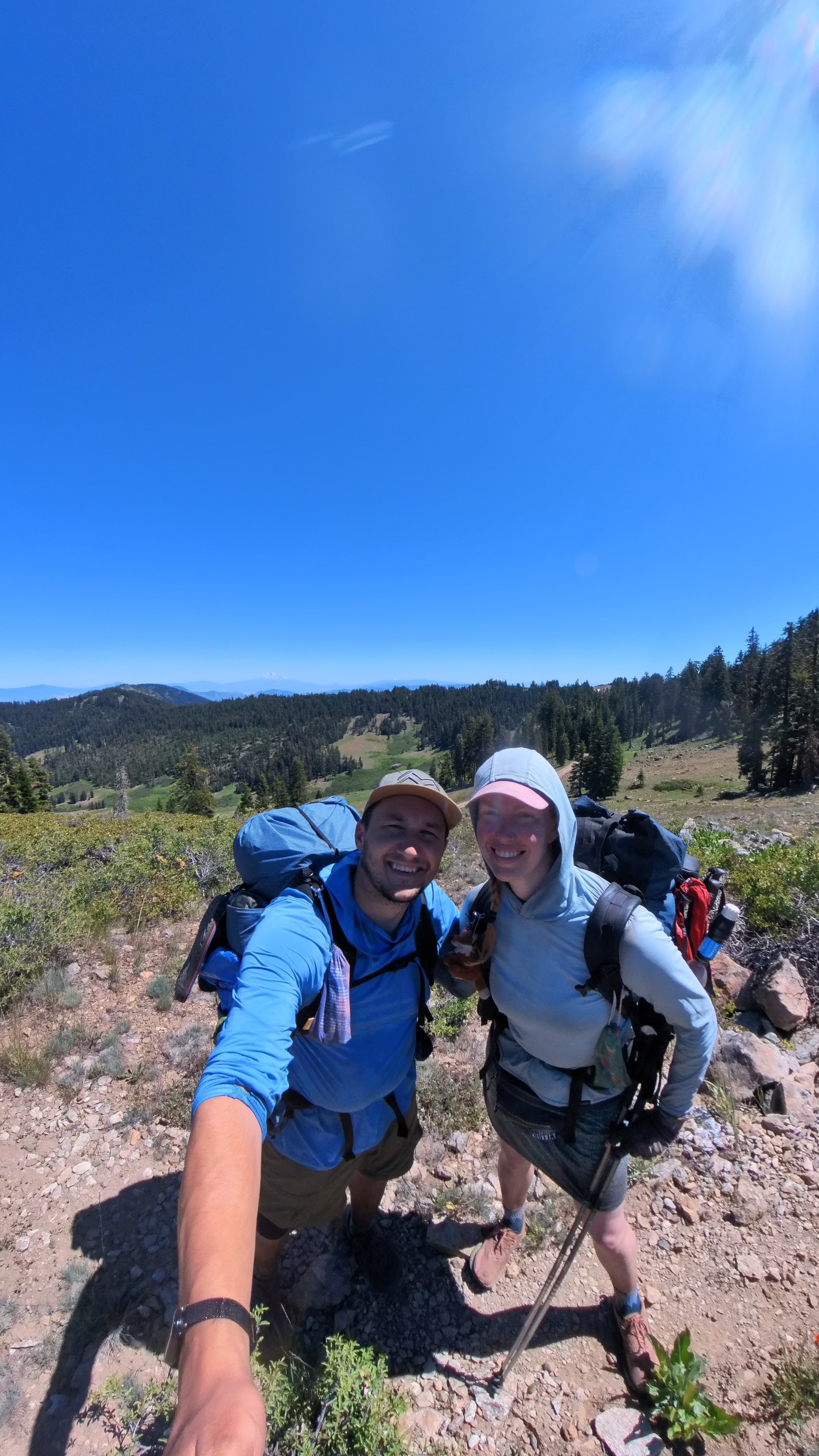 Backpacking together on mountain trail