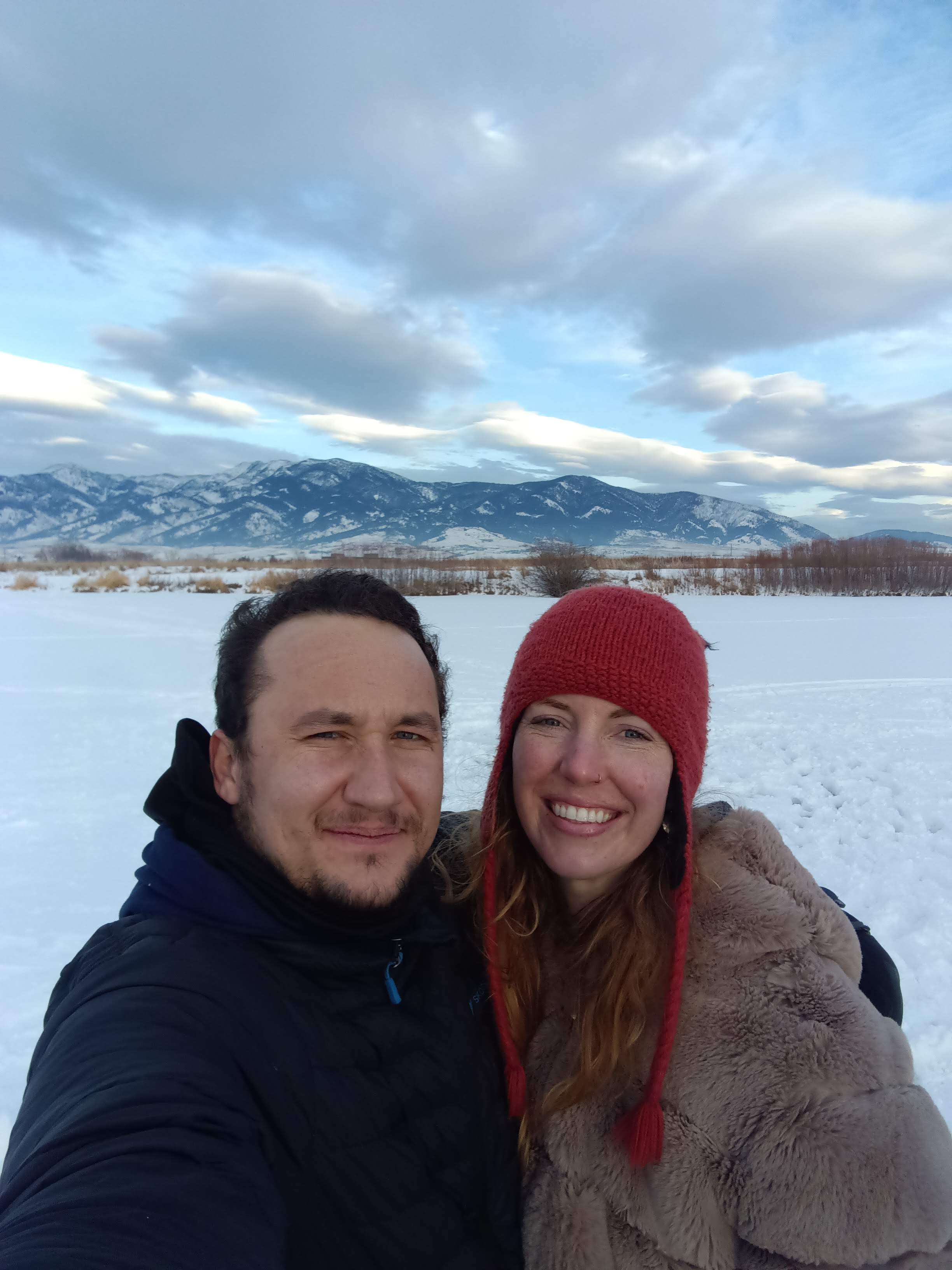 Winter mountain selfie with snowy landscape